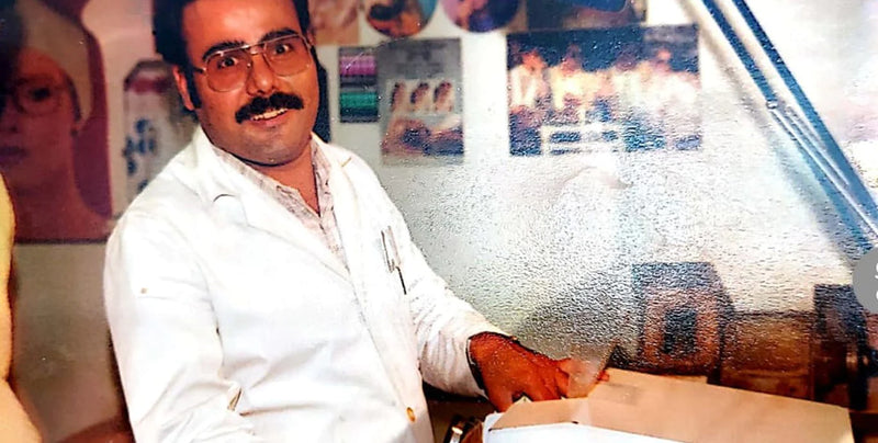 Charm Optical — 1975, Dad with a classic mustache look, while edging glasses